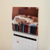 A Custom Photo Calendar showing a sleeping puppy is filled with dates imported directly from Ancestry data.