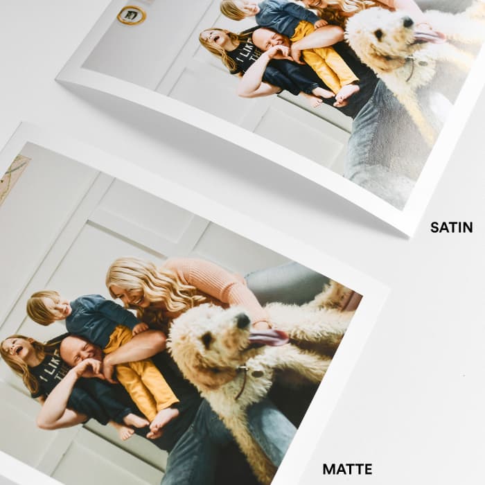 Two photo prints of the same family photo, comparing the flat matte and slightly-shiny satin finish.