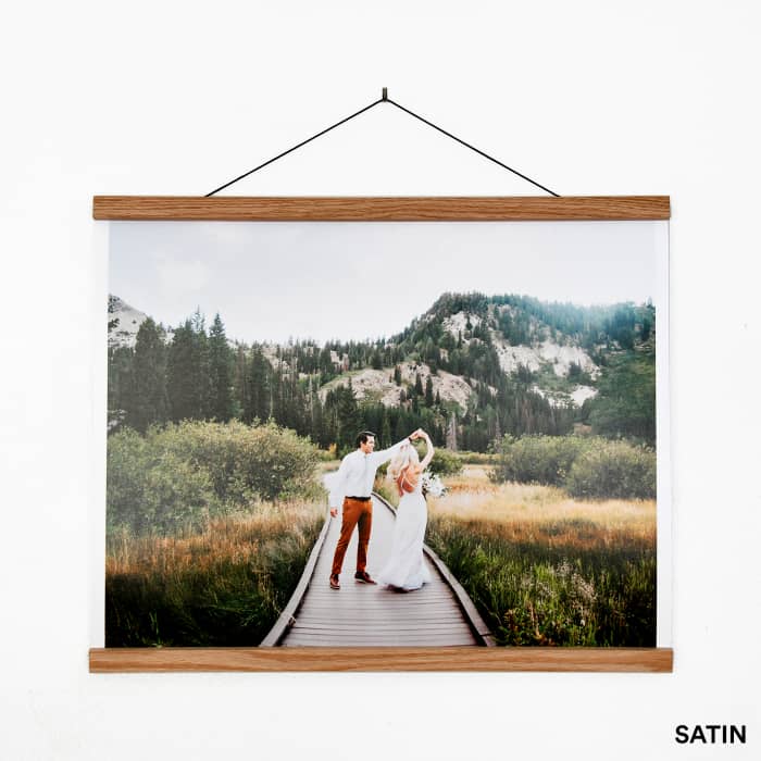 A wedding photo hanging from Oak Poster Rails. The saturated colors show off the Satin paper finish option.
