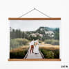A wedding photo hanging from Oak Poster Rails. The saturated colors show off the Satin paper finish option.