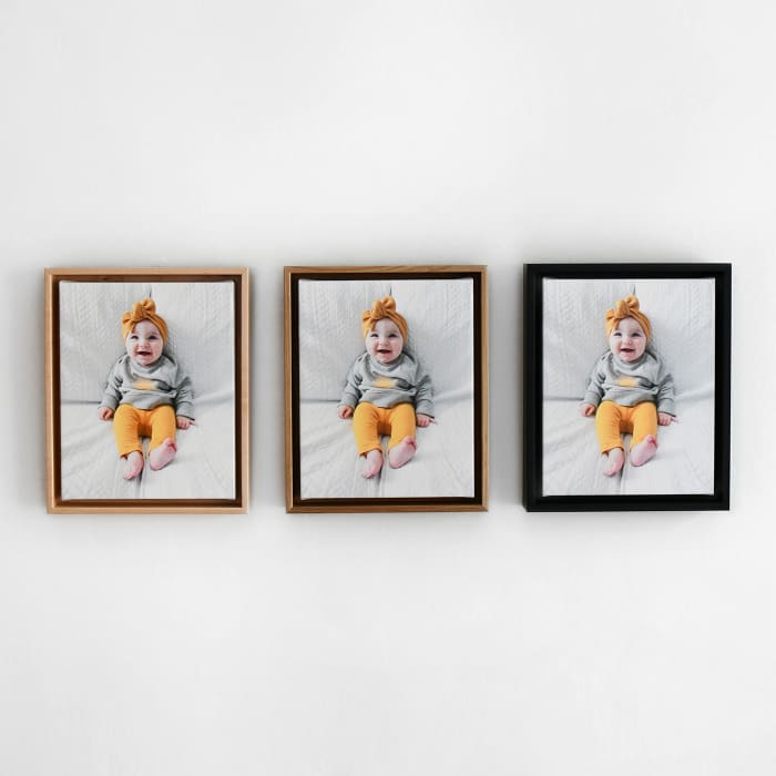 3 Framed Canvas Prints show the frame color options - light wood Maple, darker wood Oak and painted Black.