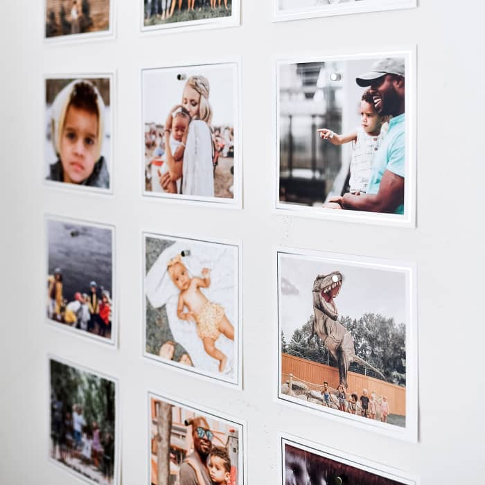 Good Hangups hold a 3x3 photo grid of Foil Bordered Square Prints featuring family photos in place.