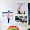Photos of some cute kids hung using Good Hangups, decorate a child's playroom.