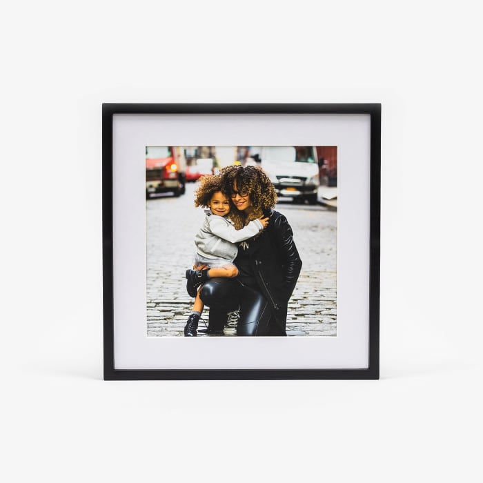 A single black framed photo print featuring a picture of a mom and son.