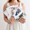 A person holding five custom Photo Greeting Cards fanned out.