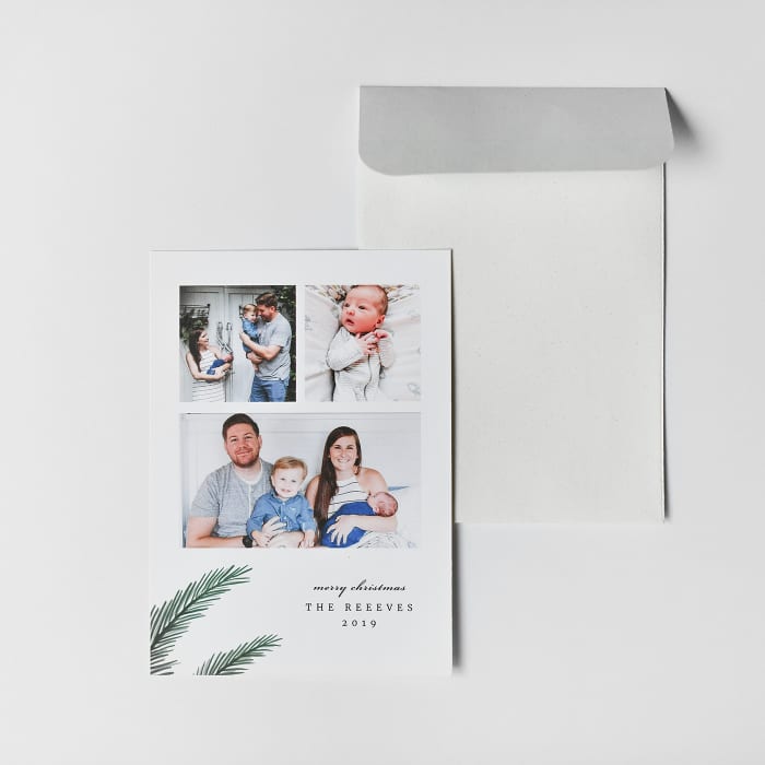 A custom family photo Christmas Card and corresponding envelope are displayed on a white background.