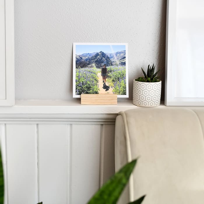 A 4-inch Square Print placed in a Wood Block sits on decorative ledge in a living room.