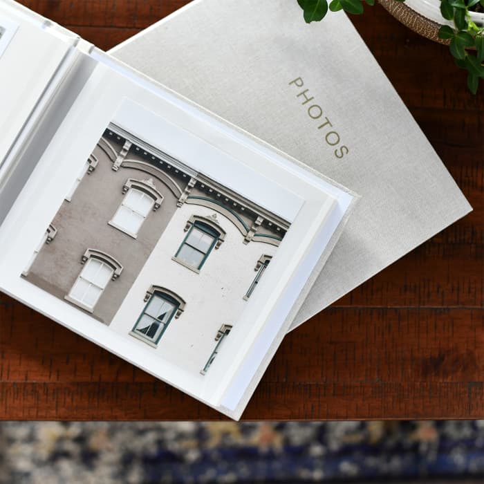 A 5.5 inch Square Print is displayed on the page of a linen covered Square Print Photo Album.