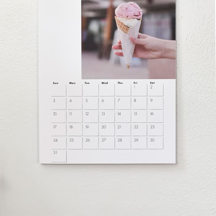 A closeup of an ice cream photo and dates on a 11x17 inch spiral bound Wall Calendar.