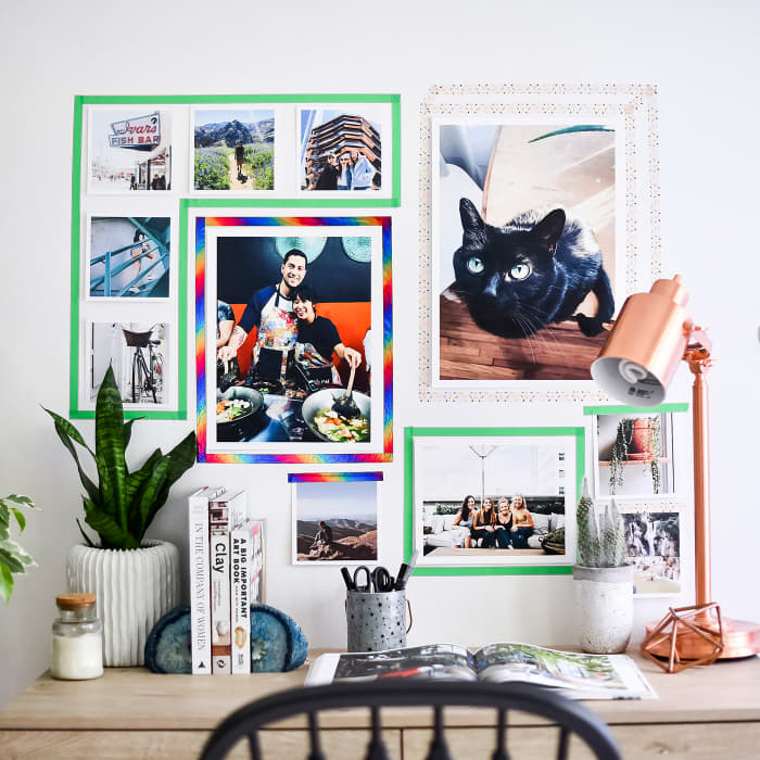 Washi Tape is used to create the appearance of colorful frames on a gallery wall of photos.