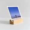 A sideview of a Wood Block showing the groove the photo, in this case a 4x4 inch Square Print beach vacation photo, rests in.