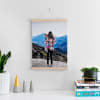 A Fine Art Print of a mother and baby photo hangs above a desk from 12 inch Maple Poster Rails.