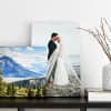 A 12x12 vacation photo and a 12x18 wedding photo as Gallery Wrapped Canvas Prints are displayed on a bookshelf.
